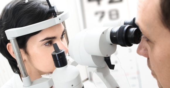 Woman with optometrist getting an eye test